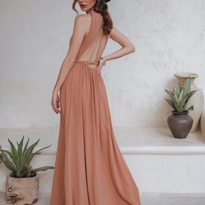 When it comes to bridesmaid dresses, we got you sorted. Check out our dusty pink, open back summer dress with applied lace details at waistline!