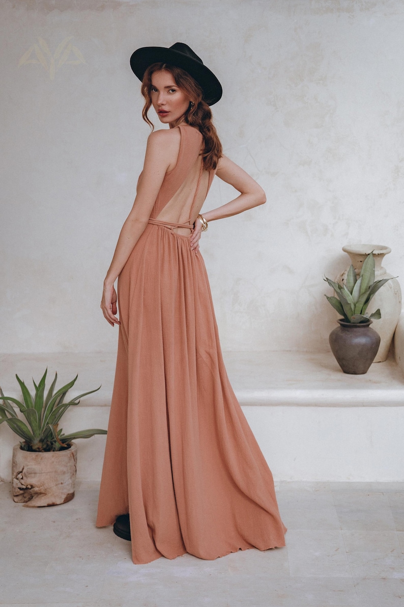 When it comes to bridesmaid dresses, we got you sorted. Check out our dusty pink, open back summer dress with applied lace details at waistline!