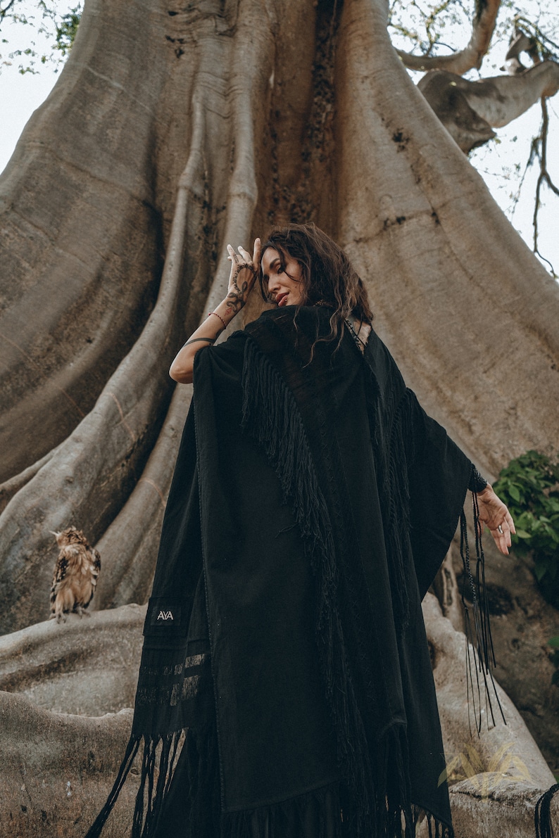 Step into the new season in style with our Bohemian Black Long Poncho, available in sizes XS/S/M/L.