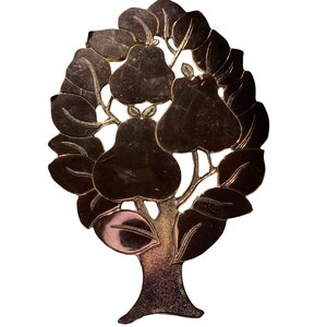 May include: A gold-coloured metal ornament shaped like a tree with leaves and pears. The ornament has a textured surface and a shiny finish.