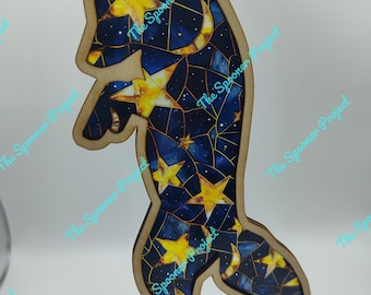 May include: Wooden ornament shaped like a fox with a blue and gold starry night design. The fox is standing on its hind legs with its tail curled around its body.