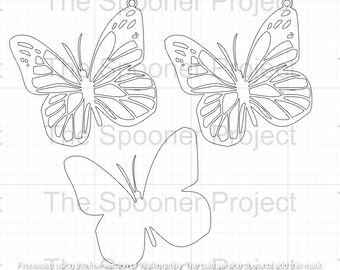 May include: Three black and white butterfly cutouts. The butterflies are in a variety of sizes and have intricate wing patterns. The butterflies are on a white grid background.