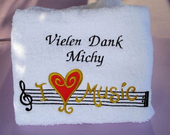 Towel embroidered with music motif