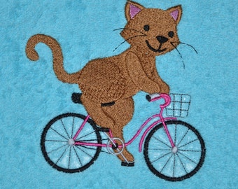 Towel kittens on bike