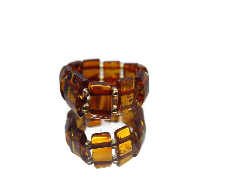 Natural Baltic amber ring on silicone