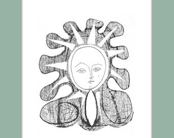 May include: Black and white framed print of a sun-like face with a halo of rays. The artwork is signed and numbered 56/100. The print is set in a white mat and a black frame with a light green border.
