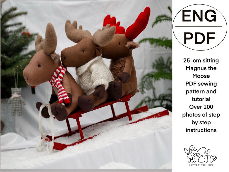 May include: Three plush moose toys, two brown and one with red antlers, sitting on a red wooden sled. The moose are wearing scarves and sweaters. The image includes the text "ENG PDF 25 cm sitting Magnus the Moose PDF sewing pattern and tutorial Over 100 photos of step by step instructions Heti LITTLE THINGS".