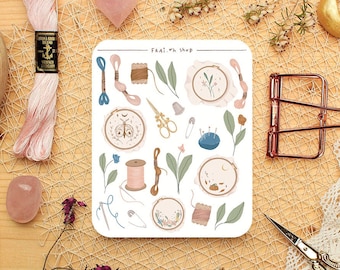 May include: A sheet of stickers featuring various embroidery-themed illustrations, including hoops, needles, thread, scissors, and flowers. The stickers are on a white background and have a whimsical, hand-drawn style. The text "FRAI. "h shop" is printed at the top of the sheet.