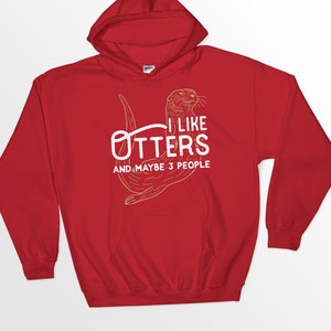 May include: Red hooded sweatshirt with a white graphic of an otter and the text "I like otters and maybe 3 people".