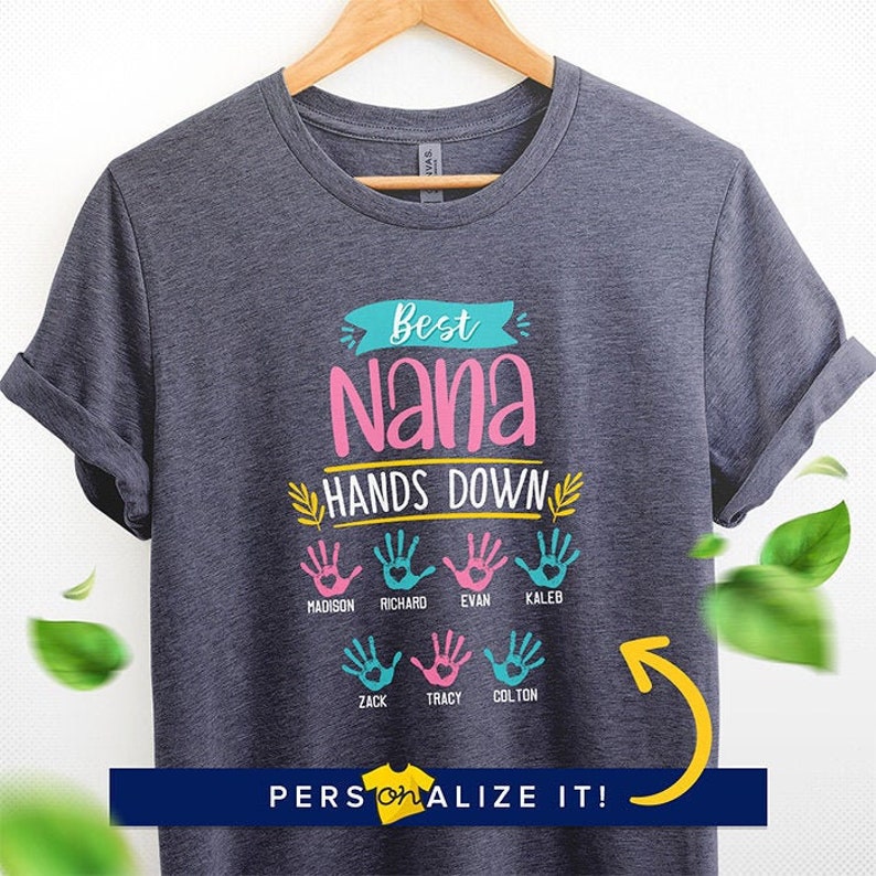 May include: A gray t-shirt with the text "Best Nana Hands Down" in colorful letters. The shirt features handprints with names like Madison, Richard, Evan, Kaleb, Zack, Tracy, and Colton.