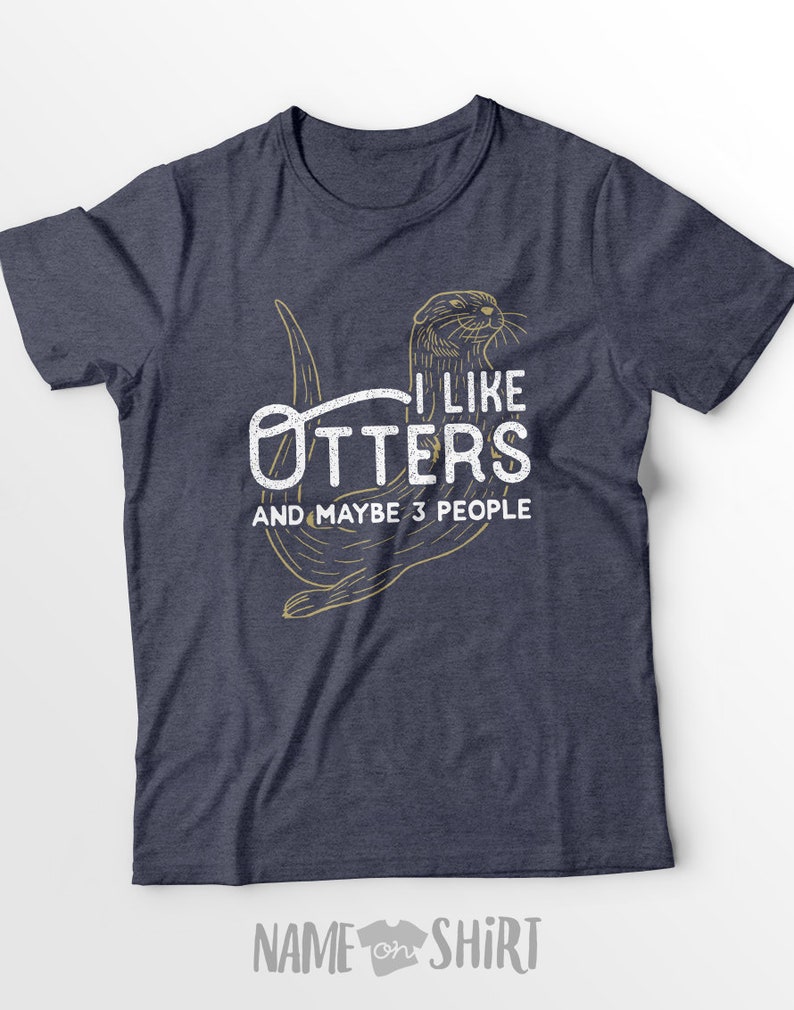 May include: A navy blue t-shirt with a graphic of an otter and the text "I like otters and maybe 3 people".