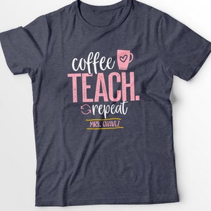 May include: A navy blue t-shirt with the text "coffee teach repeat" in pink with a coffee cup icon. The text "MRS. CHAVEZ" is in yellow.