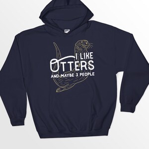 May include: Navy blue hooded sweatshirt with a graphic of an otter and the text "I like otters and maybe 3 people".