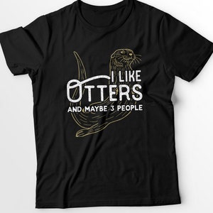 May include: Black t-shirt with a graphic of an otter and the text "I like otters and maybe 3 people".