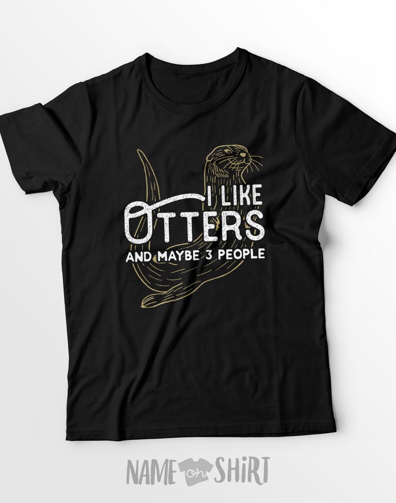 May include: Black t-shirt with a graphic of an otter and the text "I like otters and maybe 3 people".
