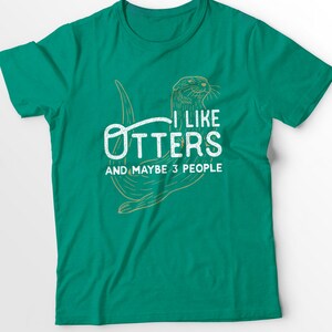 May include: A green t-shirt with a white graphic of an otter and the text "I like otters and maybe 3 people".