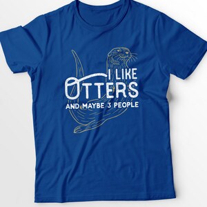 May include: A royal blue t-shirt with a graphic of an otter and the text "I like otters and maybe 3 people".
