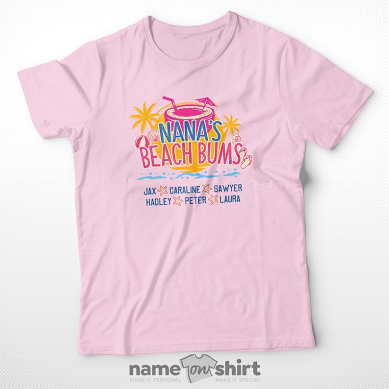 May include: Pink t-shirt with a graphic of a tropical drink and the text "Nana's Beach Bums". Below the graphic are the names "Jax, Caraline, Sawyer, Hadley, Peter, Laura".