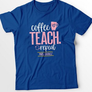 May include: Blue t-shirt with the text "coffee teach repeat" in pink and a pink coffee cup with a heart. The text "MRS. CHAVEZ" is in gold below the text.