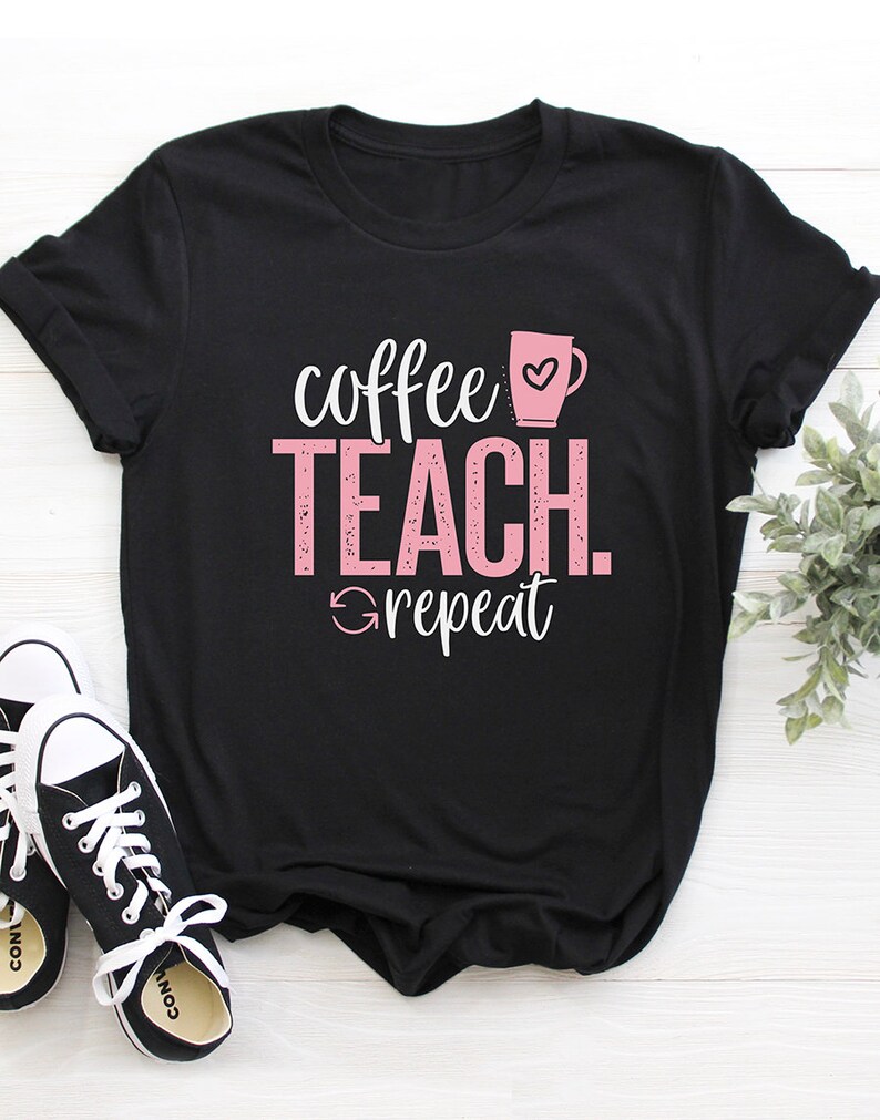 May include: Black t-shirt with pink text that reads "coffee teach repeat" and a pink coffee cup with a heart.