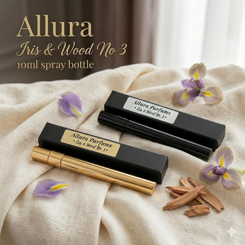 May include: A gold and a black 10ml spray bottle are presented with their boxes, each labelled "Allura Parfums Iris & Wood No. 3". The image features purple iris flowers and wood chips. The bottles are for the fragrance "Iris & Wood No 3".