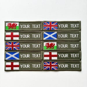 May include: Embroidered patches featuring flags of the UK, England, Scotland, and Wales. Each patch has the text "YOUR TEXT" in white lettering on a green background. Ideal for customisation.