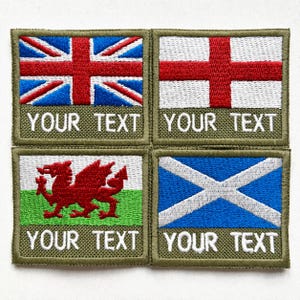 May include: Four embroidered patches displaying the flags of the UK, England, Wales, and Scotland. Each patch has a green border and the text "YOUR TEXT" in white. The flags are in red, white, and blue.