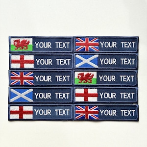 May include: A selection of embroidered patches featuring flags such as the Union Jack, Welsh flag, Scottish flag, and St. George's Cross. Each patch has a blue background with the text "YOUR TEXT" in white.
