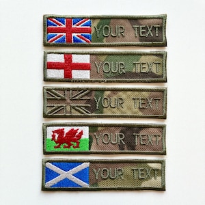May include: Five rectangular embroidered patches with different flag designs. The patches display the Union Jack, the flag of England, a stylized Union Jack, the Welsh flag, and the Scottish flag. Each patch has the embroidered text "YOUR TEXT" in a matching font.
