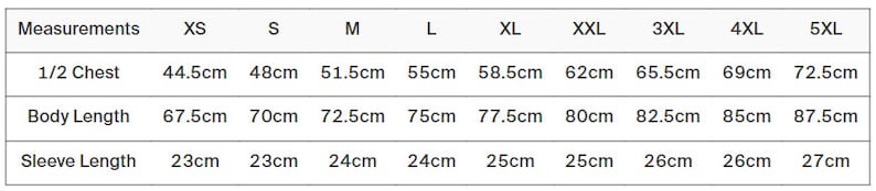 May include: A white table displays a clothing size chart with measurements in centimeters. The chart includes sizes XS to 5XL, listing half-chest, body length, and sleeve length measurements for each size. The measurements are in centimeters.
