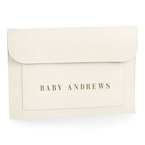 May include: A white felt envelope with the text "BABY ANDREWS" printed in gold.