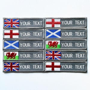 May include: A selection of embroidered patches displaying the Union Jack, St. George's Cross, St. Andrew's Cross, and the Welsh Dragon. Each patch has a gray background with the text "YOUR TEXT".