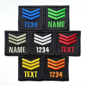 May include: A collection of embroidered patches with chevron designs in various colors, including blue, green, white, red, yellow, and orange. Each patch features text or numbers, such as "1234", "NAME", and "TEXT", in a contrasting color.