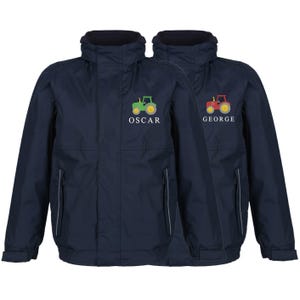 May include: Two navy blue jackets featuring embroidered tractor designs. One jacket displays a green tractor with the name "OSCAR", the other a red tractor with "GEORGE". Both have zip closures and hoods. Ideal for outdoor wear.