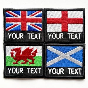 May include: Four embroidered patches displaying the flags of the UK, England, Wales, and Scotland. Each patch has a black border and the text "YOUR TEXT" in white. The flags are in their respective colours.