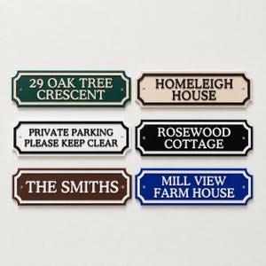 May include: Six rectangular signs with decorative scalloped edges and mounting holes. The signs feature raised lettering in various colour combinations: dark green, cream, white, black, brown, and blue, displaying custom text for homes and parking.