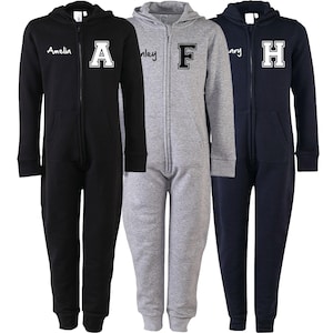 May include: Three black, gray, and navy blue hooded zippered jumpsuits with a large white letter on the front. The letters are A, F, and H. The jumpsuits are made of a soft, comfortable material.