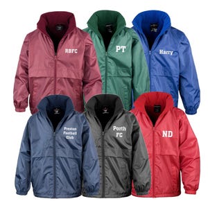 May include: Six fleece jackets in different colours with white embroidered text. The jackets are maroon, green, blue, navy blue, black and red. The text on the jackets reads "RBFC", "PT", "Harry", "Preston Football Club", "Porth FC" and "ND".