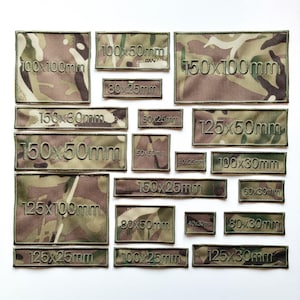 May include: A selection of rectangular camouflage patches in various sizes, with measurements in millimetres embroidered on each. The patches feature a mix of brown, green, and tan colours, and are arranged on a white surface.