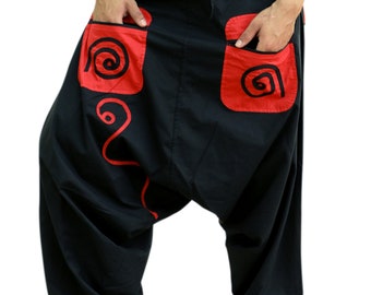 May include: Black cotton pants with red embroidered designs. The pants have a loose, baggy fit and a drawstring waistband.