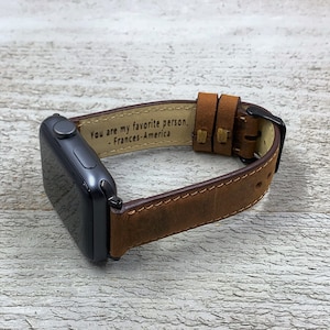May include: Brown leather watch band with a personalized message that reads "You are my favorite person. - Frances-America".
