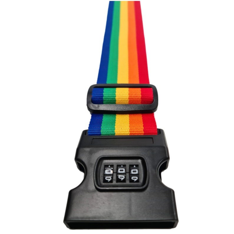 The image features a rainbow-colored strap with a black plastic lock buckle, typically used for securing items like luggage. The vibrant strap displays the full spectrum of rainbow colours in vertical stripes, and the traditional rainbow sequence.