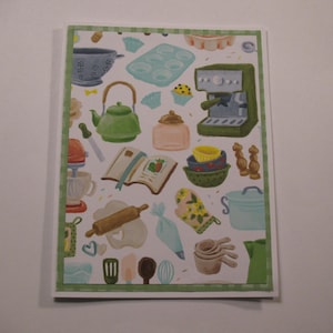 May include: A greeting card with a white background and a green border, featuring a collage of kitchen-themed illustrations. The illustrations include a teapot, mixer, coffee maker, and various baking tools. The card is perfect for a baker.