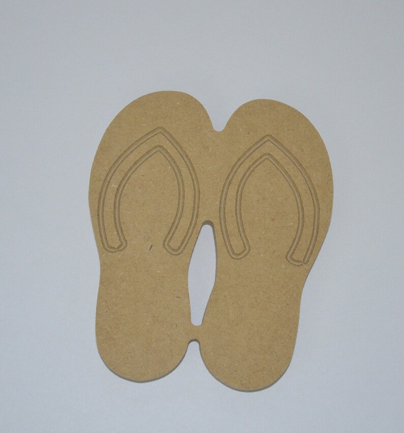 May include: A pair of brown wooden flip-flop cutouts. The flip-flops are connected at the toe.