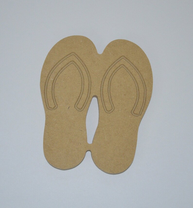 May include: A pair of brown wooden flip-flop cutouts. The flip-flops are connected at the toe and heel.