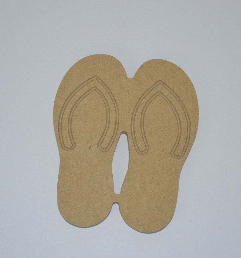 May include: A pair of brown wooden flip-flop cutouts. The flip-flops are connected at the toe.