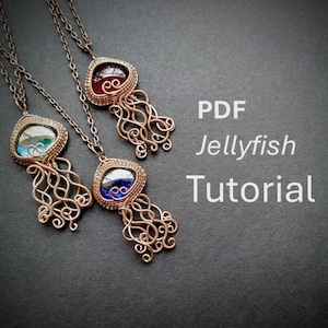 May include: Three copper-toned pendant necklaces with jellyfish designs. Each pendant features a colorful, gem-like center and intricate wirework tentacles. The image includes the text "PDF Jellyfish Tutorial".