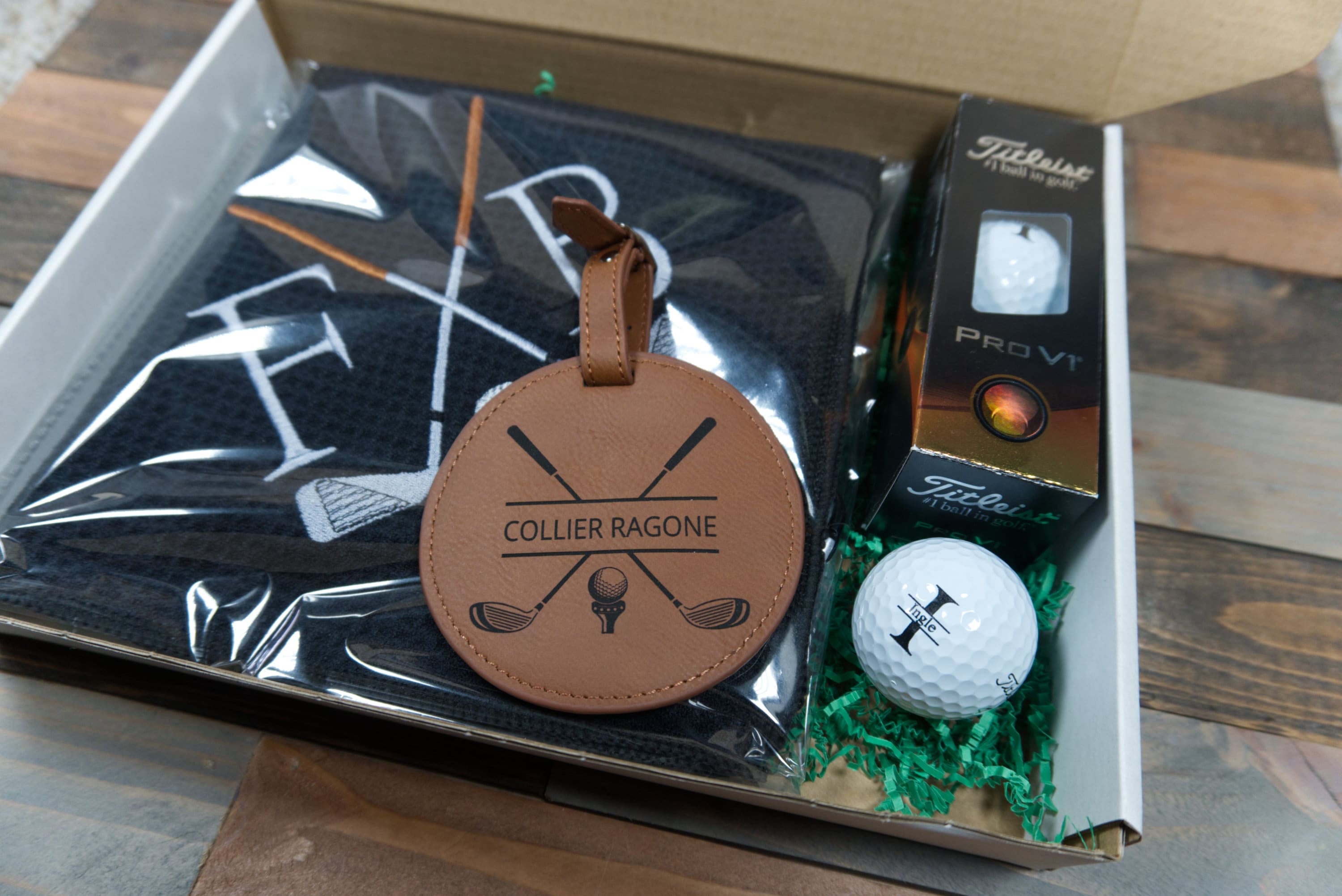 Personalized Golf Gift Box. Include a golf towel, a set of three golf Pro V1 balls with monograms, and a golf bag tag with tee holder