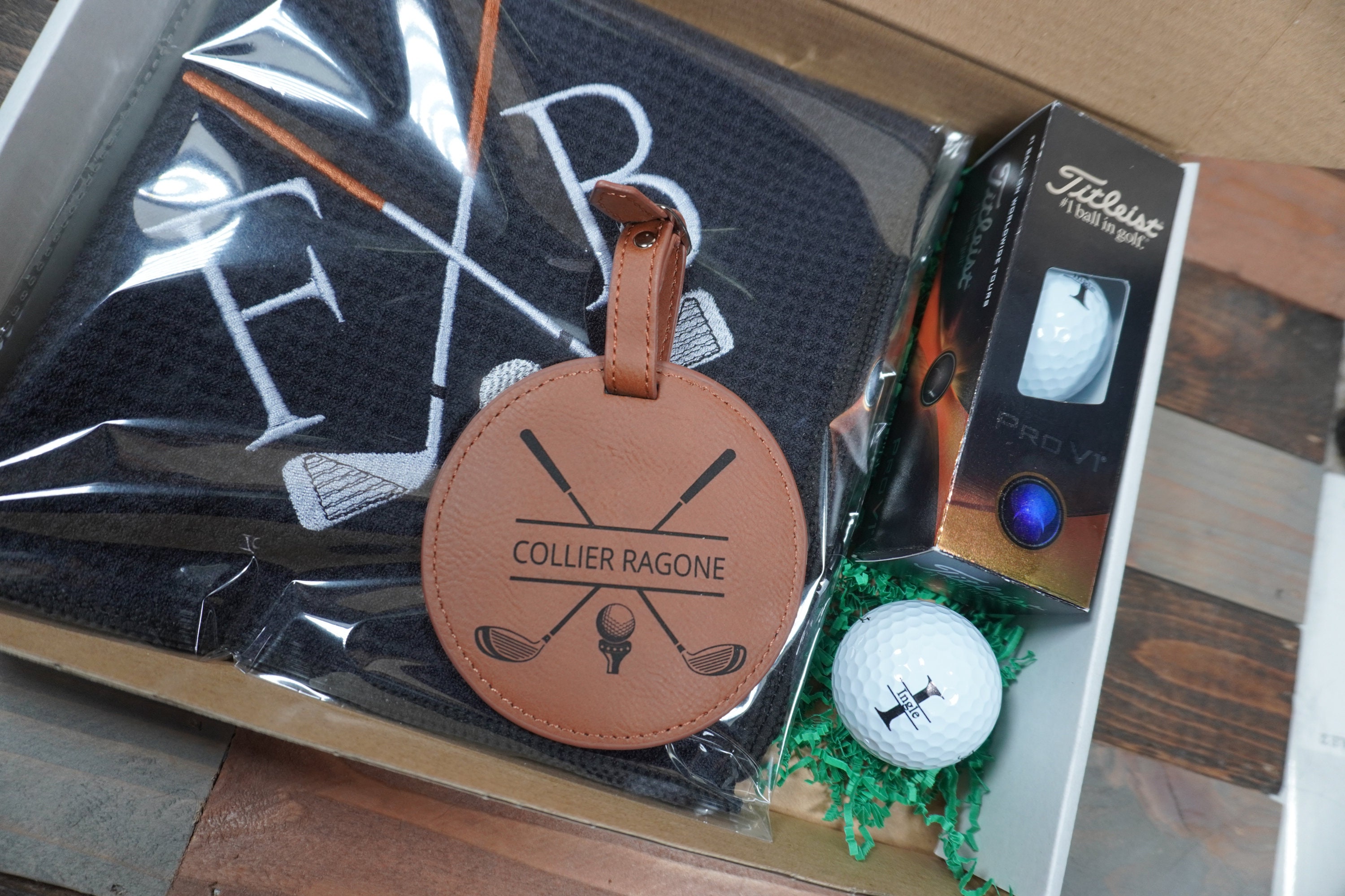 Personalized Golf Gift Box. Include a golf towel, a set of three golf Pro V1 balls with monograms, and a golf bag tag with tee holder