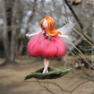 Needle felted pink flower ballerina with orange hair, Waldorf inspired red-hair fairy standing on a leaf